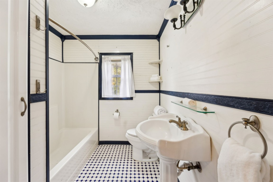 463465 State Road 200 Yulee, FL 32097 - Photo 9 of 20 a bathroom with a sink a mirror and a shower