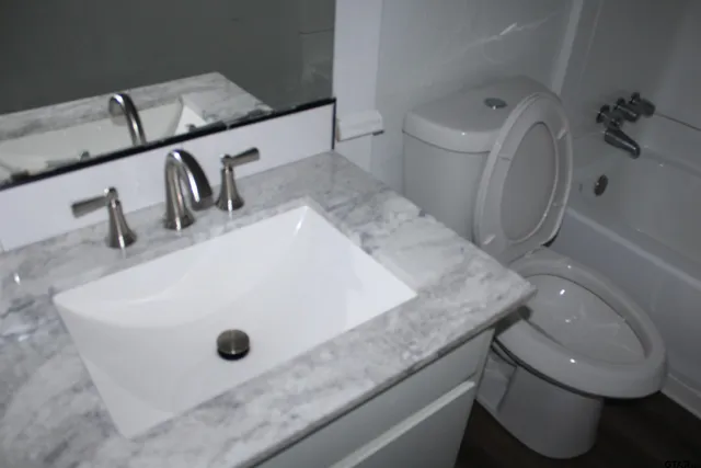 a bathroom with a sink and mirror