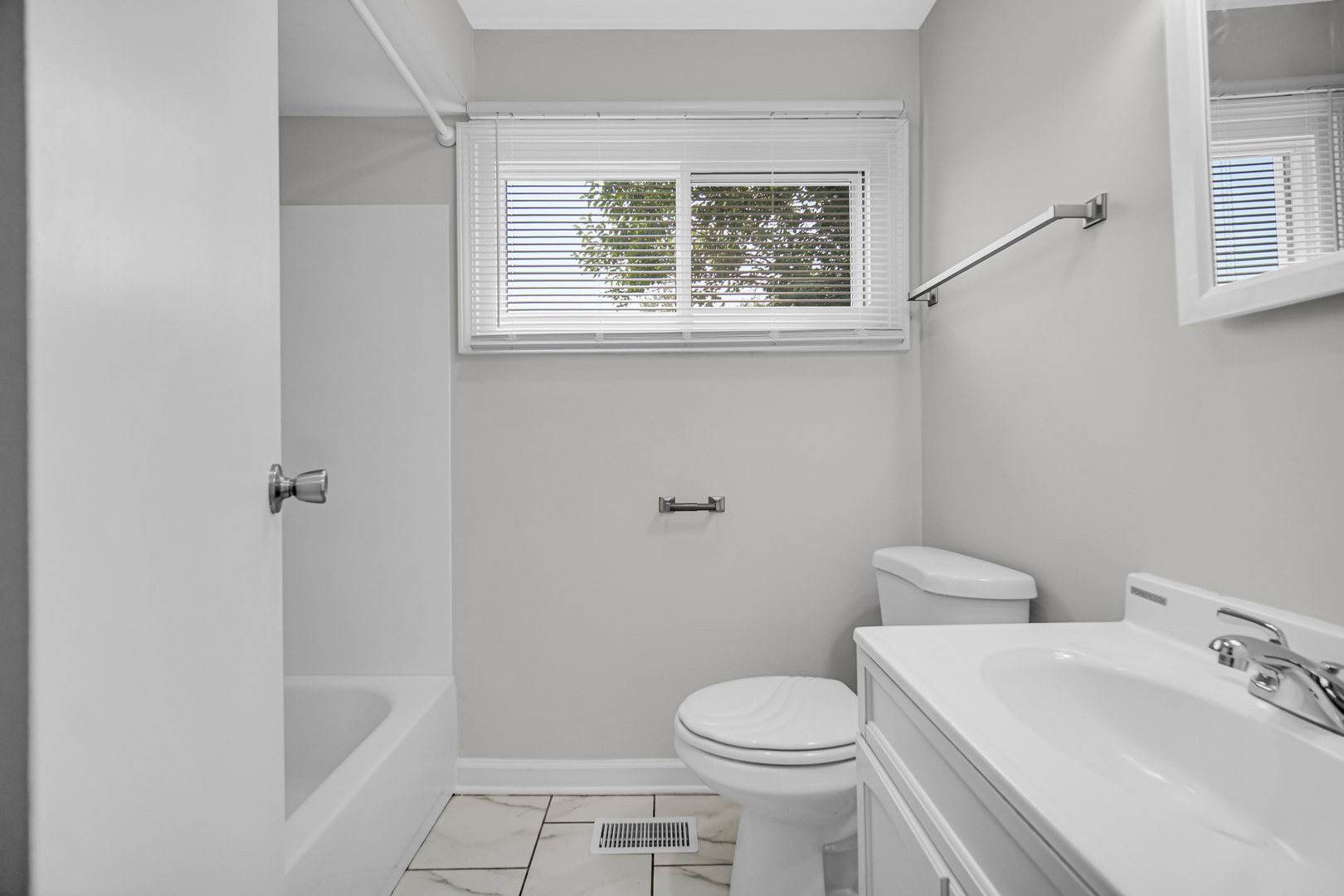 263 Sangamon Street Park Forest, IL 60466 - Photo 11 of 17 a white toilet sitting next to a bathroom sink