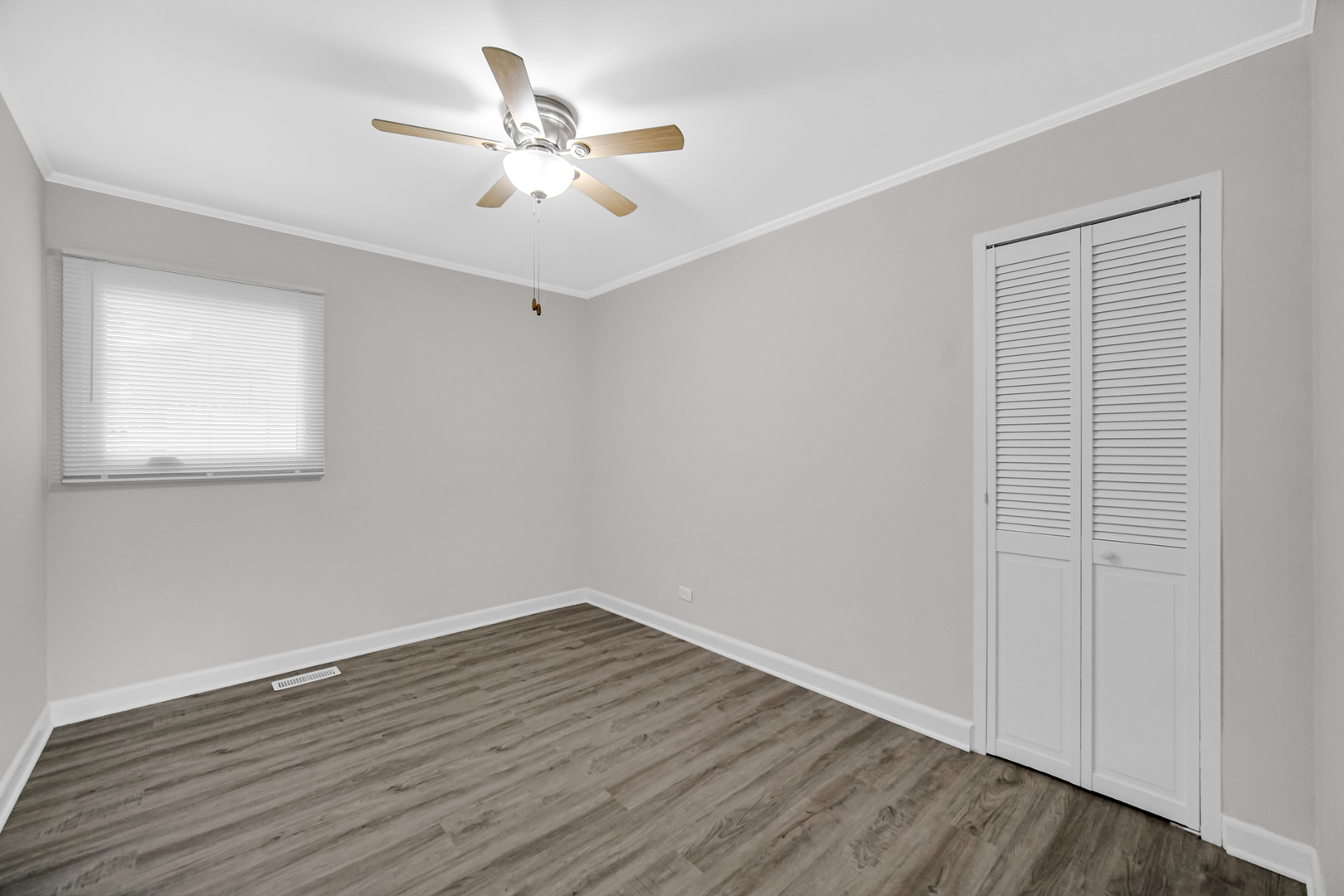 263 Sangamon Street Park Forest, IL 60466 - Photo 12 of 17 a view of a room with wooden floor and a ceiling fan