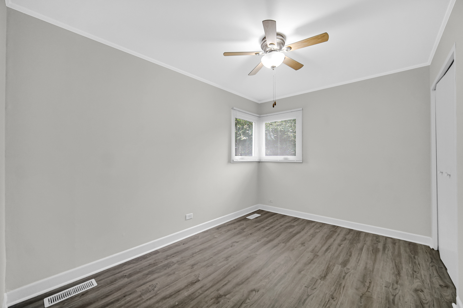 263 Sangamon Street Park Forest, IL 60466 - Photo 14 of 17 a view of a room with wooden floor and a ceiling fan