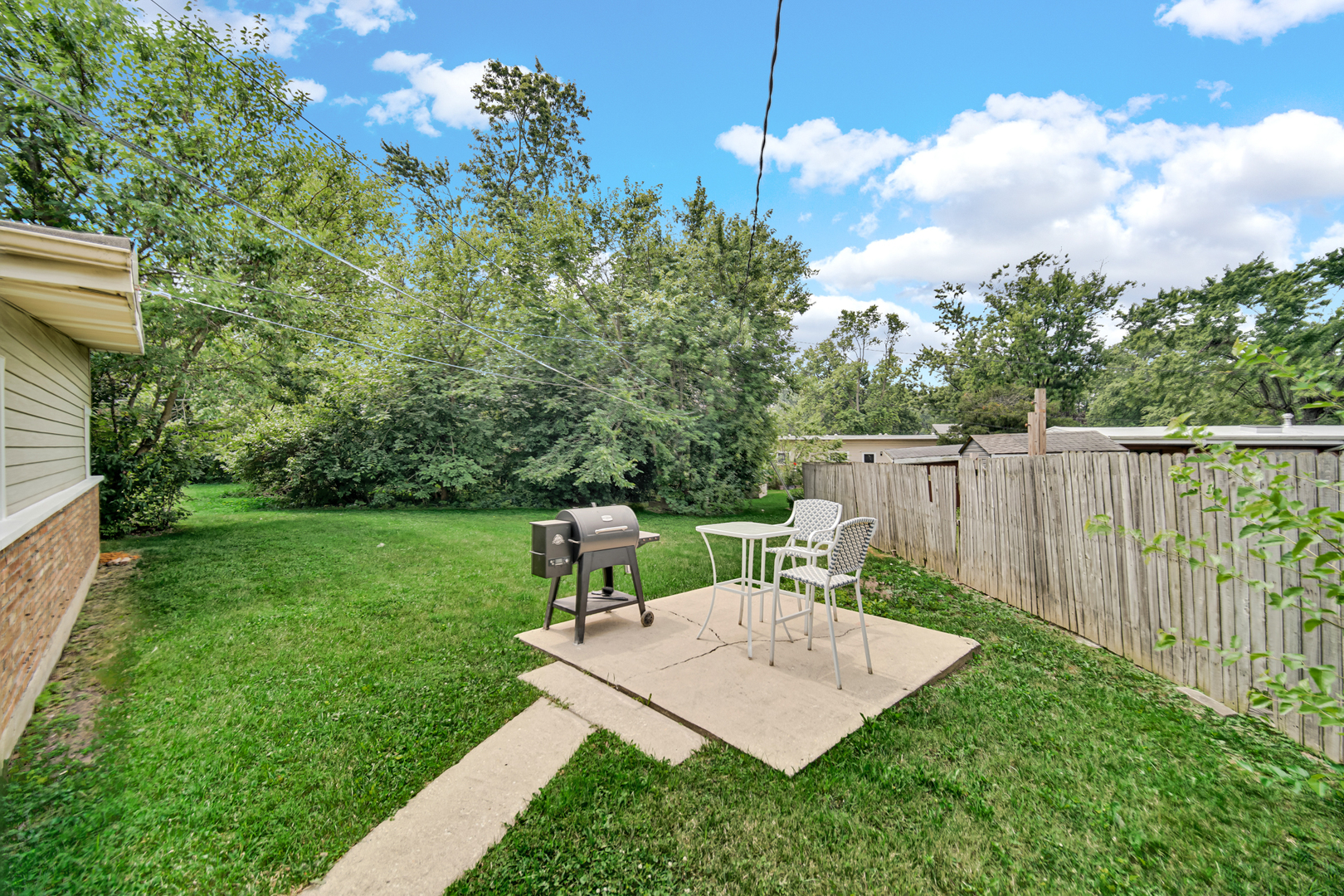 263 Sangamon Street Park Forest, IL 60466 - Photo 15 of 17 a view of a backyard with sitting area