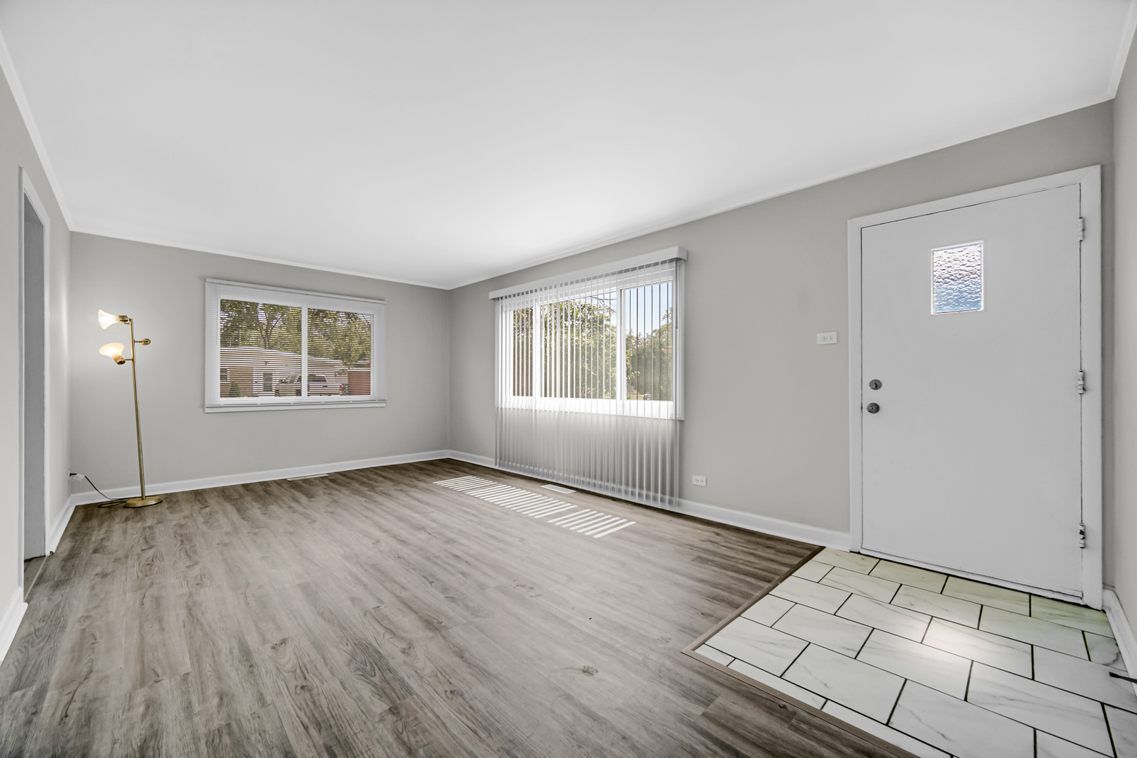 263 Sangamon Street Park Forest, IL 60466 - Photo 2 of 17 wooden floor in an empty room with a window