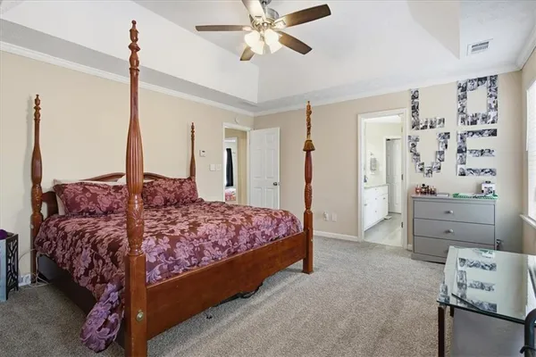 a bedroom with a bed and cabinets