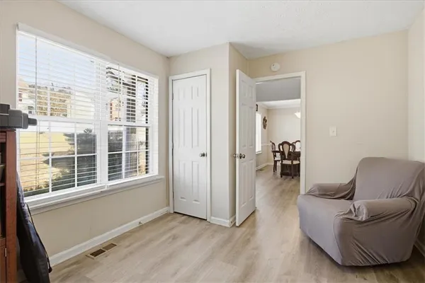 a living room with furniture and a window