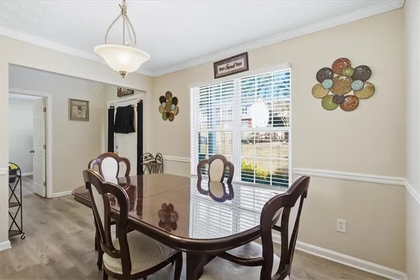 a view of a dining room with furniture window and outside view