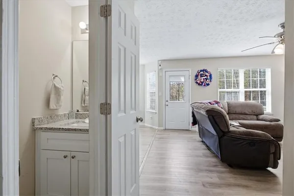 a bedroom with furniture and a window