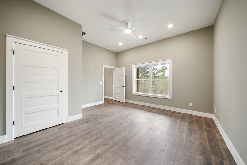 2956 Blalock Mountain Road Talking Rock, GA 30175 - Photo 32 of 63 wooden floor in an empty room with a window