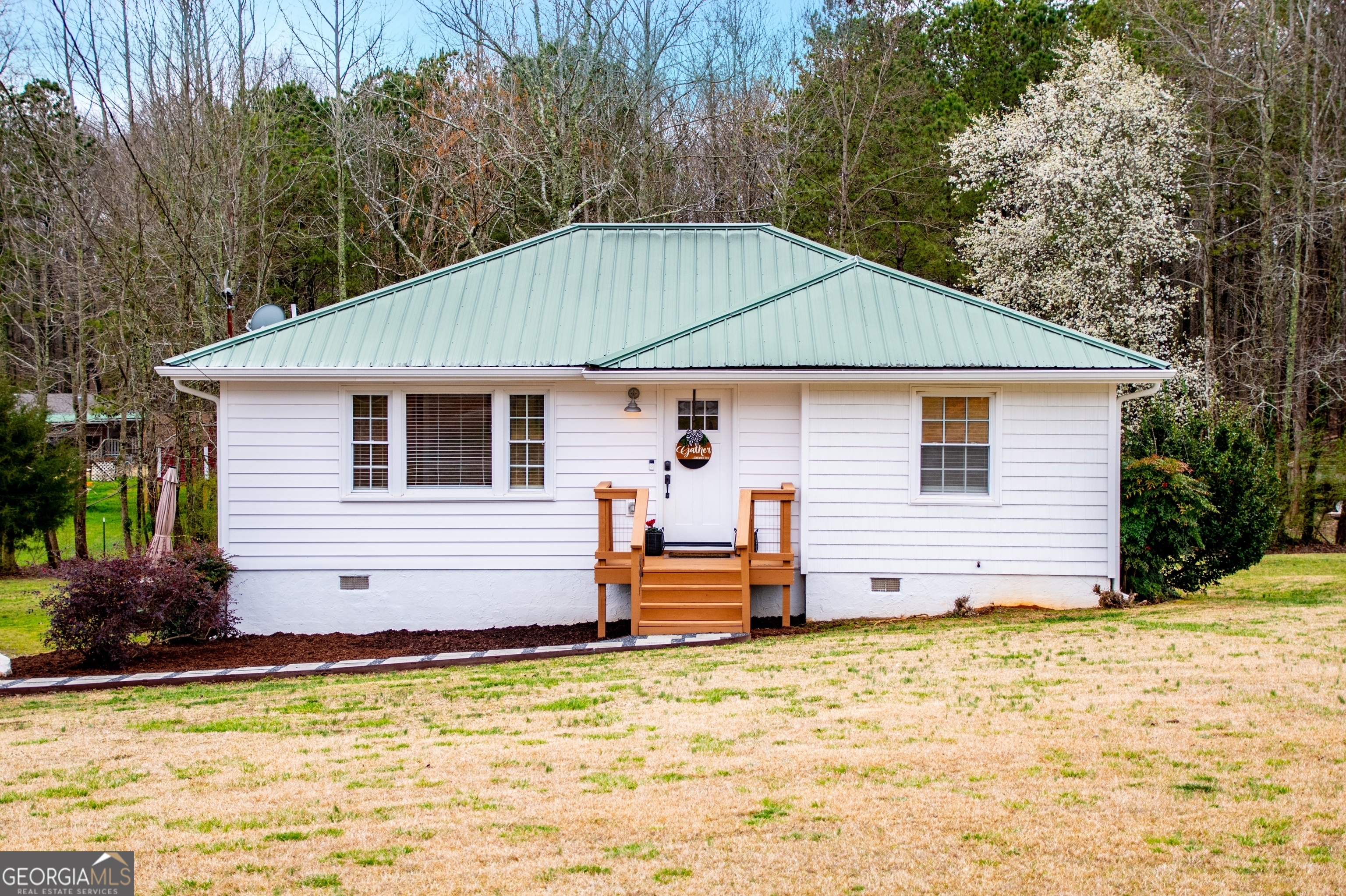 653 Ringer Road Carrollton, GA 30116 - Photo 1 of 1 a view of a house with a yard