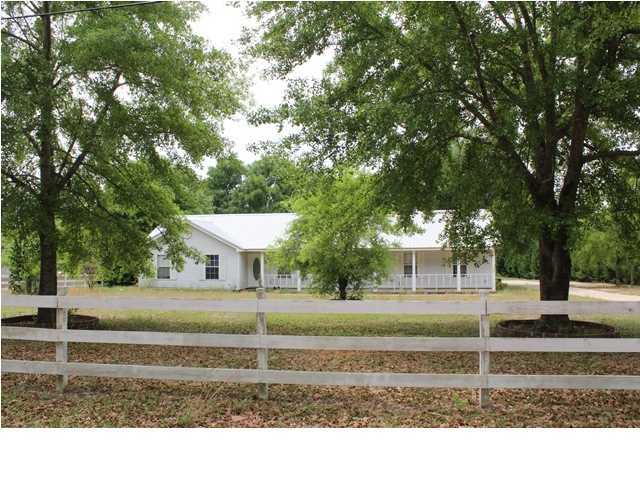 1492 McCauley Road Baker, FL 32531 - Photo 1 of 16 a view of a house with a yard