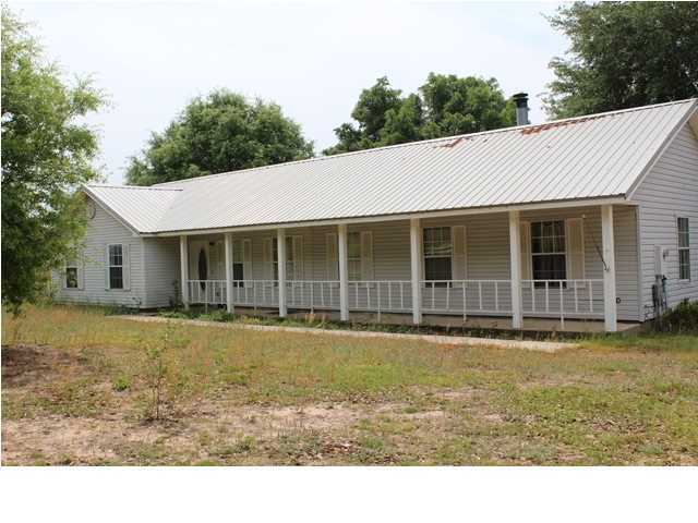 1492 McCauley Road Baker, FL 32531 - Photo 2 of 16 a house with swimming pool in front of it