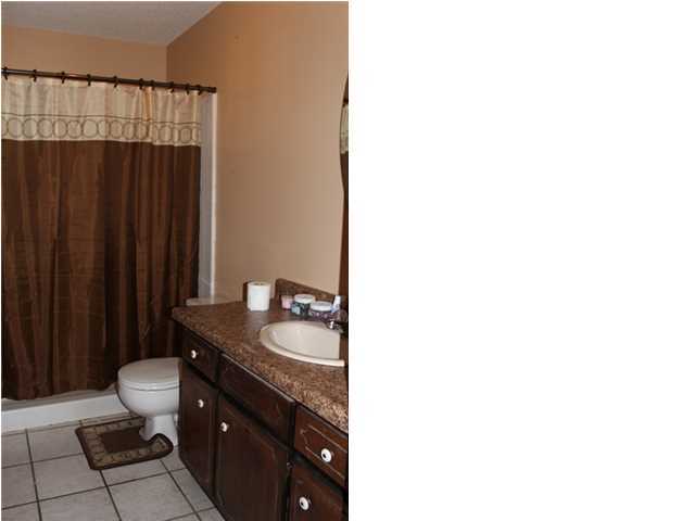 1492 McCauley Road Baker, FL 32531 - Photo 12 of 16 a bathroom with a sink and a toilet
