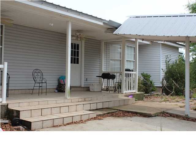 1492 McCauley Road Baker, FL 32531 - Photo 13 of 16 a black white house with outdoor space
