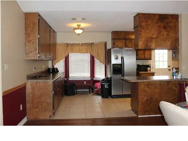 1492 McCauley Road Baker, FL 32531 - Photo 3 of 16 a living room with stainless steel appliances kitchen island granite countertop a refrigerator a stove a sink and a microwave