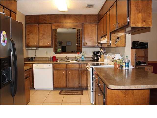 1492 McCauley Road Baker, FL 32531 - Photo 5 of 16 a kitchen with stainless steel appliances granite countertop a sink a stove and a refrigerator