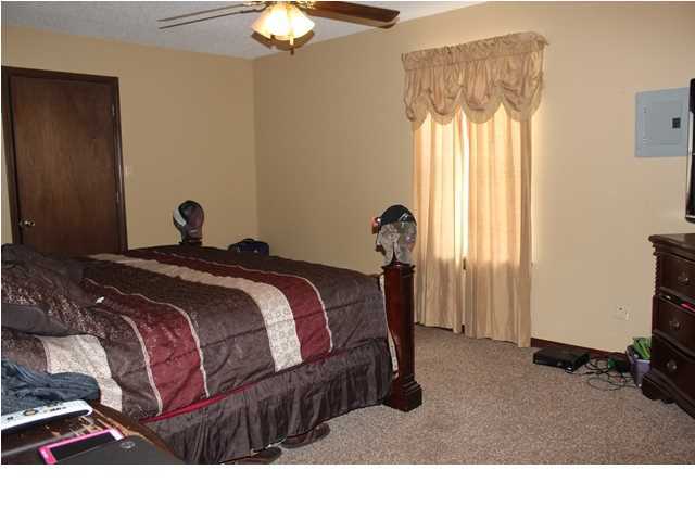 1492 McCauley Road Baker, FL 32531 - Photo 10 of 16 a bedroom with a bed and window