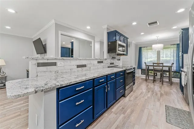 a spacious bathroom with a granite countertop sink and a mirror