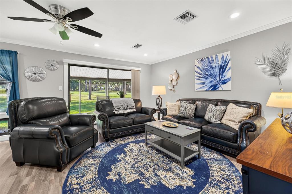 19660 Southwest 83rd Place Road, Unit C13 Dunnellon, FL 34432 - Photo 18 of 52 a living room with furniture and a rug