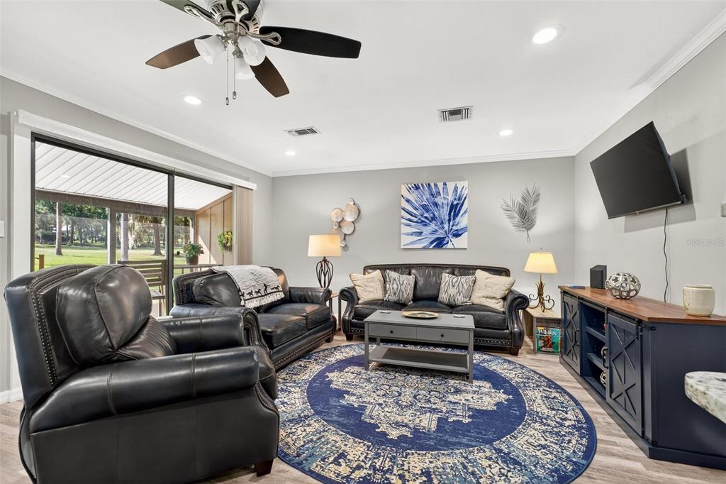 19660 Southwest 83rd Place Road, Unit C13 Dunnellon, FL 34432 - Photo 19 of 52 a living room with furniture and a flat screen tv