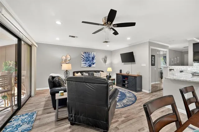a view of a dining room with furniture and wooden floor