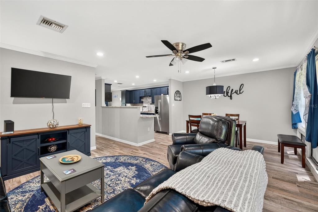 19660 Southwest 83rd Place Road, Unit C13 Dunnellon, FL 34432 - Photo 22 of 52 a living room with furniture and a flat screen tv