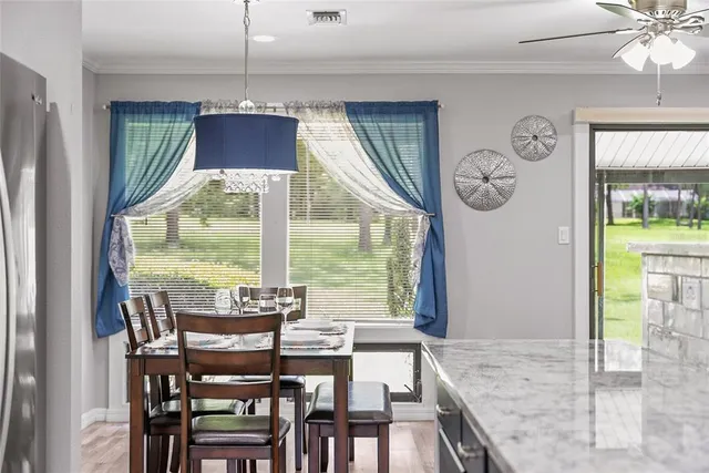 a dining room with furniture and window