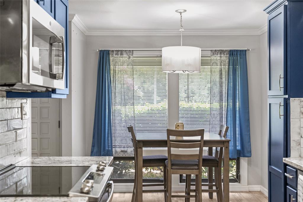 19660 Southwest 83rd Place Road, Unit C13 Dunnellon, FL 34432 - Photo 26 of 52 a dining room with furniture and window