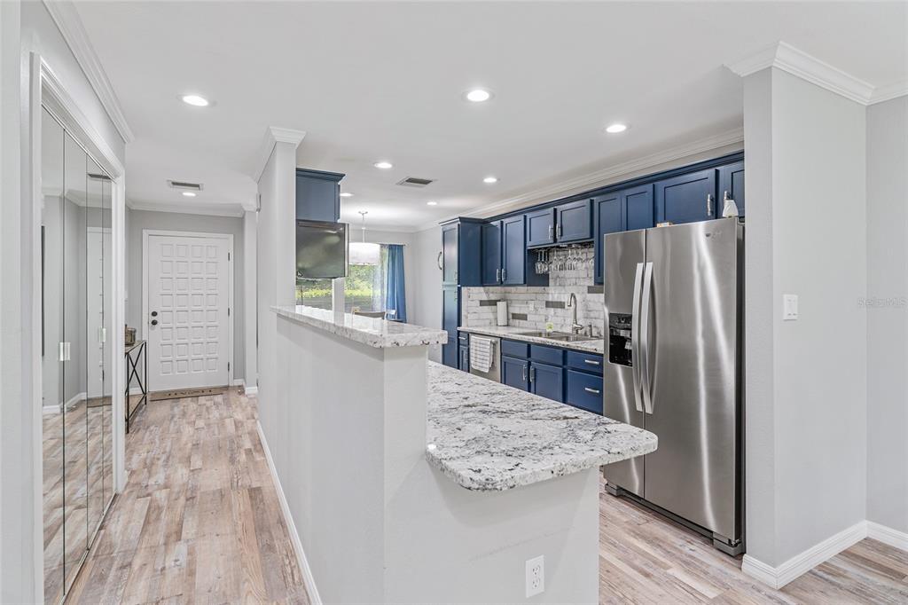 19660 Southwest 83rd Place Road, Unit C13 Dunnellon, FL 34432 - Photo 28 of 52 a kitchen with stainless steel appliances granite countertop a refrigerator and a stove