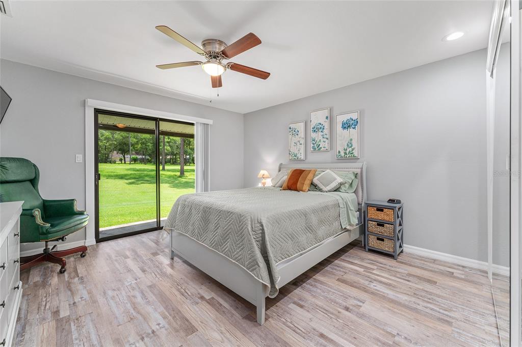 19660 Southwest 83rd Place Road, Unit C13 Dunnellon, FL 34432 - Photo 29 of 52 a bedroom with a bed and a large window