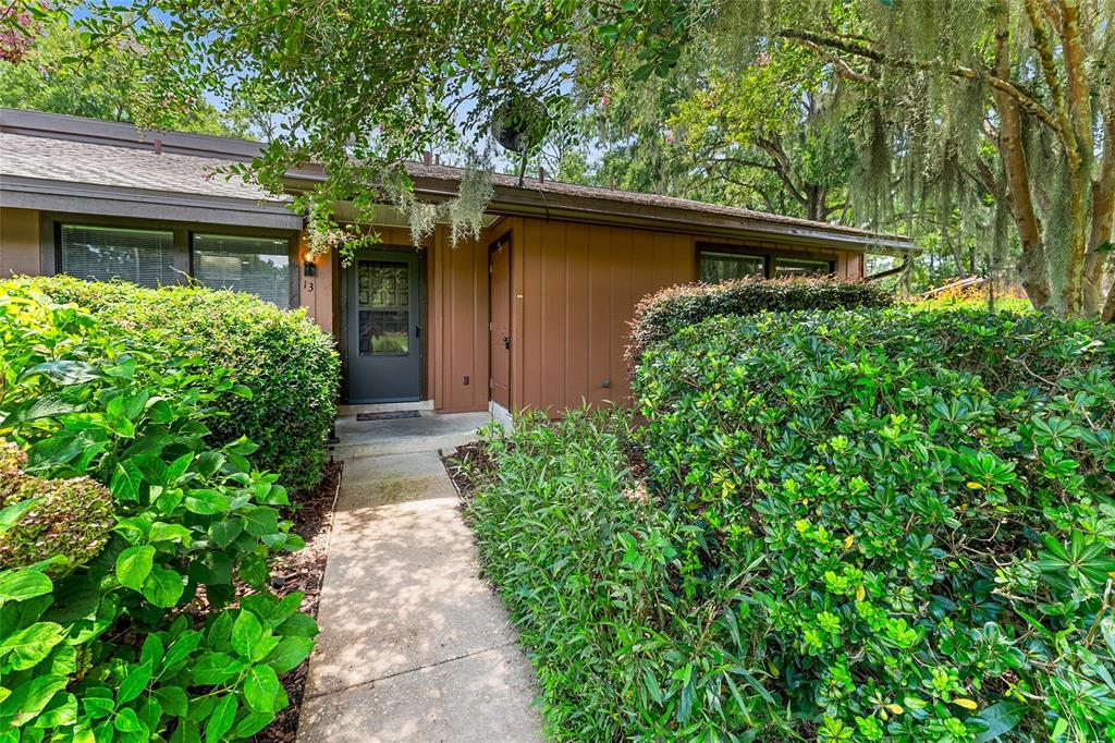 19660 Southwest 83rd Place Road, Unit C13 Dunnellon, FL 34432 - Photo 3 of 52 a view of house with large trees