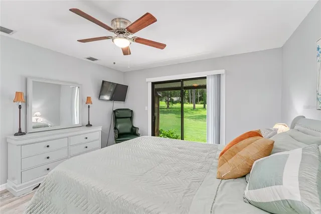 a bedroom with double bed and a large mirror