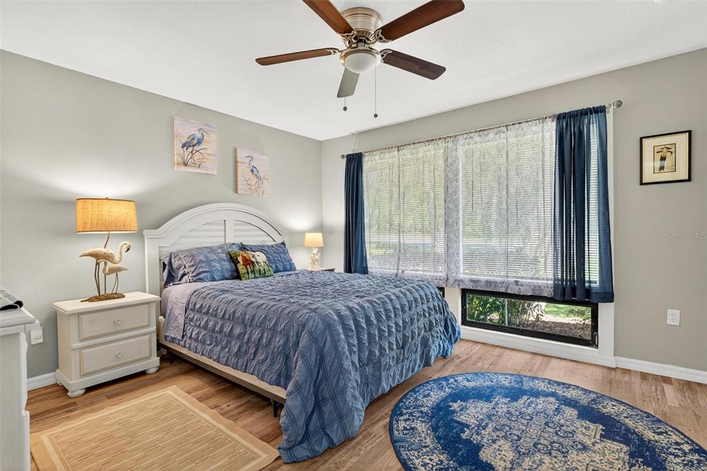 19660 Southwest 83rd Place Road, Unit C13 Dunnellon, FL 34432 - Photo 38 of 52 a bedroom with a bed and a window