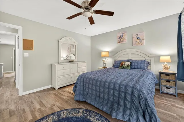 a bedroom with a large bed and a large window