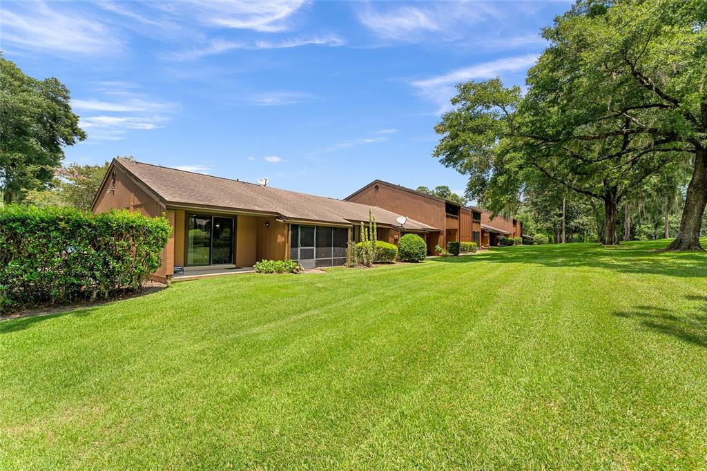 19660 Southwest 83rd Place Road, Unit C13 Dunnellon, FL 34432 - Photo 48 of 52 a front view of house with yard and green space