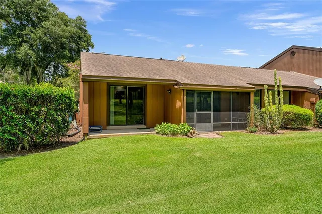 a front view of a house with garden and porch