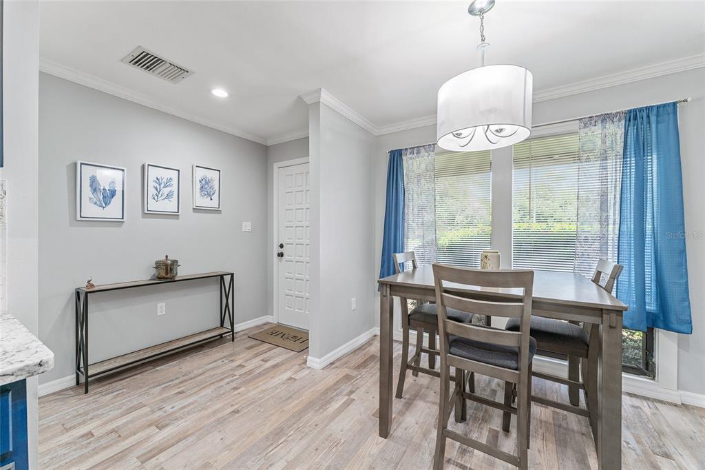 19660 Southwest 83rd Place Road, Unit C13 Dunnellon, FL 34432 - Photo 10 of 52 a view of a dining room with furniture window and wooden floor