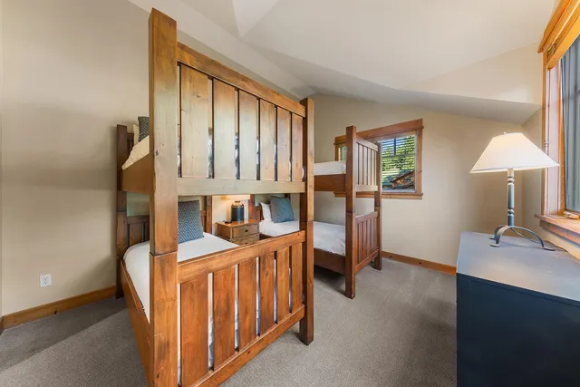 a en suite bathroom with a granite countertop sink and a mirror