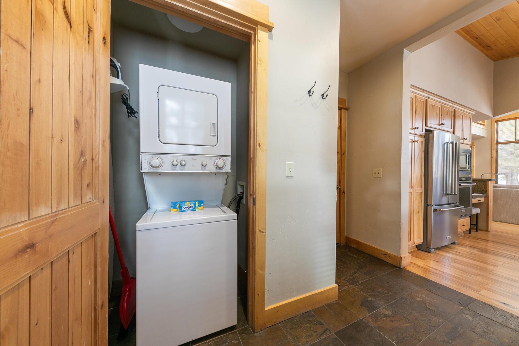 12303 Lookout Loop, Unit F0913 Truckee, CA 96161 - Photo 19 of 28 a hallway with washer and dryer