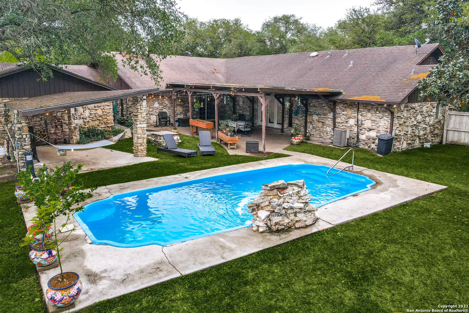 a view of a house with swimming pool yard and patio