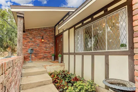 a view of porch with a bench