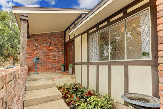 a view of porch with a bench