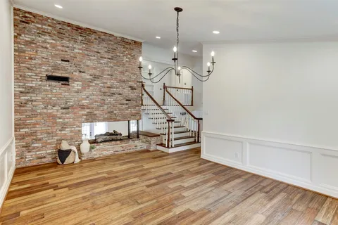 a view of a livingroom with furniture and wooden floor