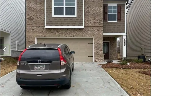 a car parked in front of a house