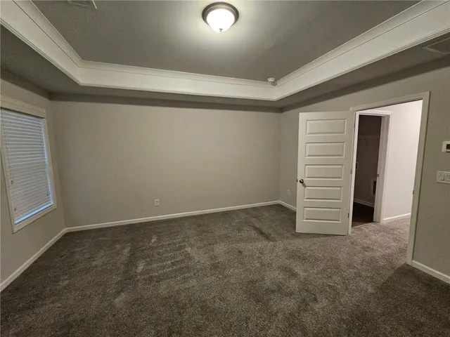 an empty room with a white door