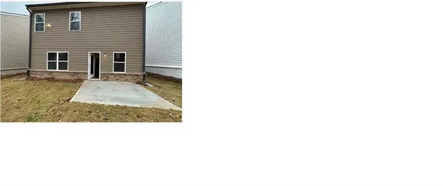 a view of a house with yard