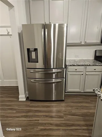 a refrigerator freezer sitting inside of a kitchen