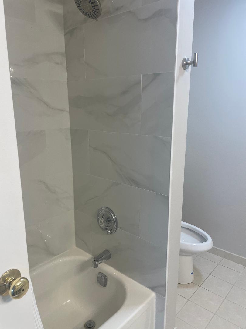 3801 Appian Way, Unit 302 Glenview, IL 60025 - Photo 13 of 16 a bathroom with a sink and toilet