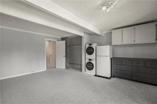 a view of a kitchen with a sink and cabinets