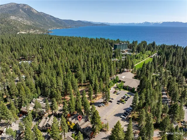 a view of a lush green hillside and houses