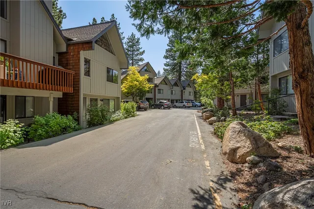 a pathway of a house with a yard
